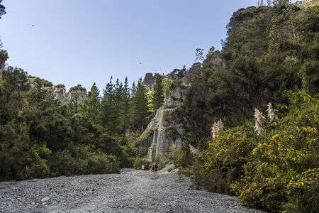 Aorangi Forest Park, New Zealand - March 03, 2018: Tourists on a trek in the Putangirua Pinnacles, New Zealandのeditorial素材