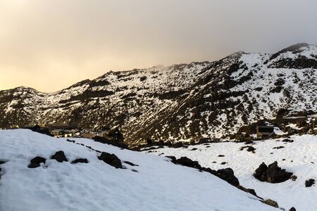 Whakapapa, New Zealand - August 11, 2018: A fiery sunset over the Top of the Bruce ski lodges, Whakapapa Skifield, New Zealand.のeditorial素材
