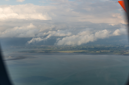 Flying above the clouds, view from the airplaneの写真素材