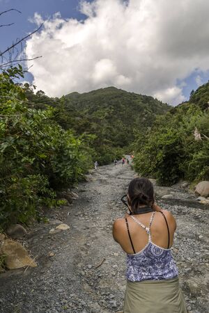 Aorangi Forest Park, New Zealand - March 03, 2018: Photographer taking photos of a tourists on a trek in the Putangirua Pinnacles, New Zealandのeditorial素材