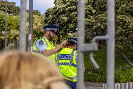 Wellington, New Zealand - October 28, 2018: Police officers fit headsets for a royal visit to the Wellington War Memorial in New Zealand.のeditorial素材