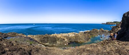 Matapouri, New Zealand - December 26, 2018: People enjoying a summer day at mermaid pools in Matapouri Beach on the North Island, New Zealand.のeditorial素材