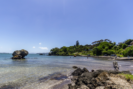 People enjoying a beautiful sunny day at Reotahi Bay, New Zealand.の写真素材