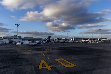 Wellington, New Zealand - January 04, 2019: Aeroplane at the Wellington terminal gate ready for takeoff during sunset on Wellington, New Zealand.のeditorial素材