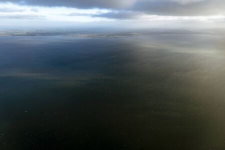 Flying above the ocean, view from the airplane, New Zealand