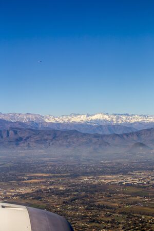 Aerial view of the Andes mountain range through the window of an airplane from Chileの写真素材