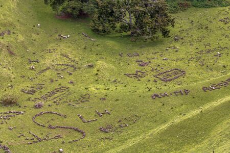 Auckland, New Zealand - August 24, 2015: Messages written with stones at One Tree Hill in Auckland,...