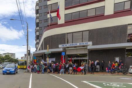 Wellington, New Zealand - October 22, 2019: People demonstrating against the violence and oppression from the government of Sebastian PiÃ±era outside the Chilean embassy in Wellington, New Zealand.のeditorial素材