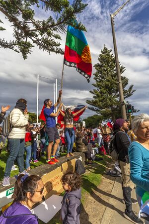 Wellington, New Zealand - October 22, 2019: People demonstrating against the violence and oppression from the government of Sebastian PiÃ±era at Frank Kitts Park in Wellington, New Zealand.のeditorial素材