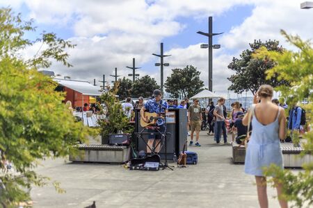 Wellington, New Zealand - December 03, 2017: A man playing music at the veggie market in Wellington, New Zealand.のeditorial素材