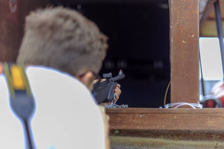 Wellington, New Zealand - December 03, 2017: A man playing shooting game at The Extravaganza Fair in Whangamata, New Zealandのeditorial素材