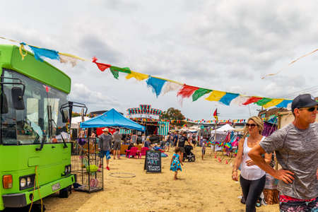 Whangamata, New Zealand - January 04, 2020: People enjoying live music and family entertainment at The Extravaganza Fair in Whangamata, New Zealand.のeditorial素材