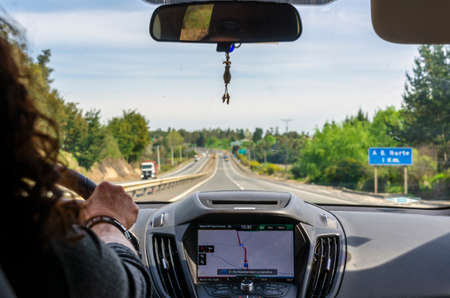 South of Chile - September 20, 2016: View of a woman inside the car of the highway on the...