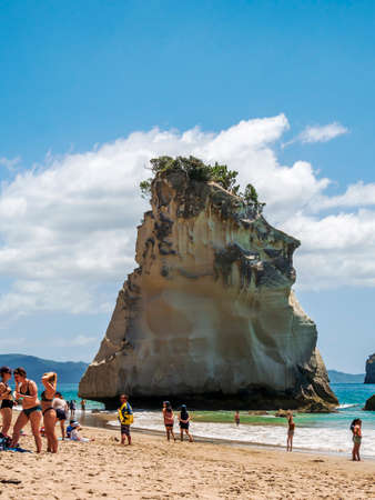 Coromandel, New Zealand - December 28, 2019: Busy day at Cathedral Cove in Coromandel Peninsula on...