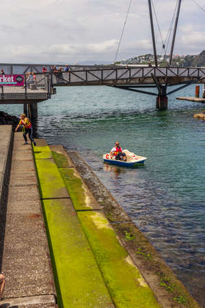 Wellington, New Zealand - December 18, 2018: Kids playing on the Wellington waterfront lagoon in New Zealandのeditorial素材