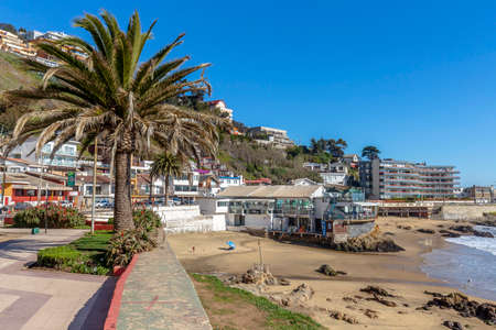 Concon, Chile - August 12, 2019: People enjoying at the large sand dunes on the coast of ConcÃ³n, Chile.のeditorial素材