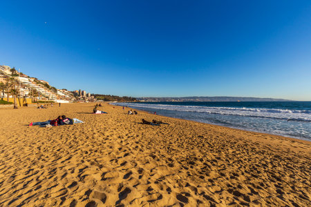 Concon, Chile - August 12, 2019: People enjoying at the large sand dunes on the coast of ConcÃ³n, Chile.のeditorial素材