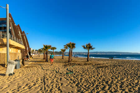 Concon, Chile - August 12, 2019: People enjoying at the large sand dunes on the coast of ConcÃ³n, Chile.のeditorial素材