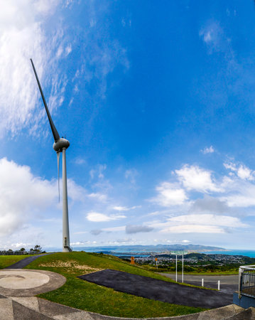 View of the wind turbine between the tree at Hawkins Hill, New Zealandの写真素材