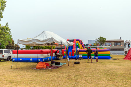 Whangamata, New Zealand - January 03, 2020: People having a good time at the Gypsy Fair in...