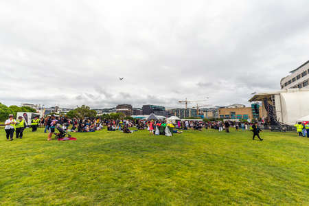 Wellington, New Zealand - February 06, 2021: People celebrate Waitangi Day with live music and delicious hÄngi at Waitangi Park in Wellington waterfront, New Zealand.のeditorial素材