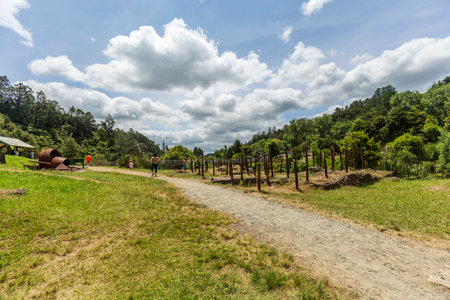 Hauraki District, New Zealand -  January 01, 2023: People enjoying visiting the ruins of industrial heritage related to the gold rush at Karangahake Gorge in New Zealandのeditorial素材