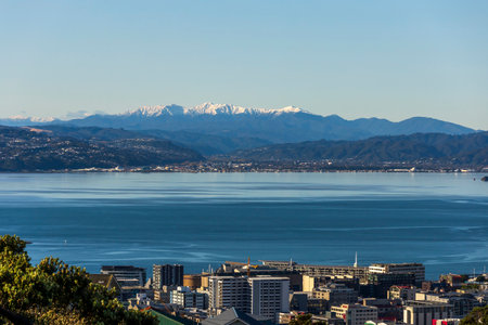Wellington, New Zealand - May 06, 2020: Snow capped mountains above Wellington Harbourのeditorial素材
