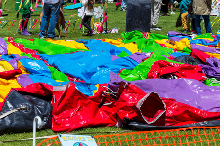Multi colored plastic sheets on the grassの写真素材