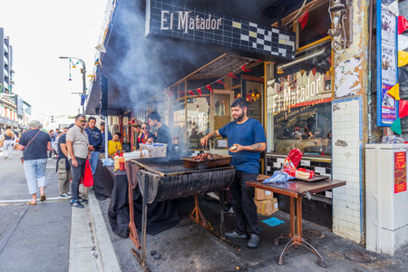 Wellington, New Zealand - March 24, 2024: People Enjoying the Vibrant Atmosphere of the Cuba Dupa Festival 2024, 2024: The Chef from El Matador Showcasing His Culinary Magic at Cuba Dupa Festivalのeditorial素材