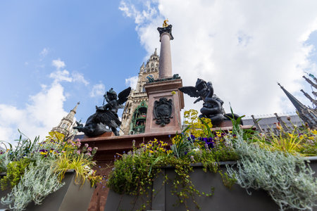 Munich, Germany - May 09, 2024: Angelic Sculptures and MariensÃ¤ule in Munich Marienplatzのeditorial素材