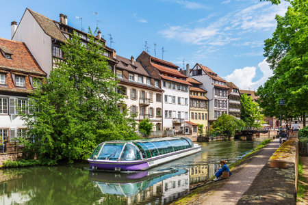 Strasbourg, France - May 13, 2024: Canal Boat Cruising in Historic Petite-France Strasbourgのeditorial素材