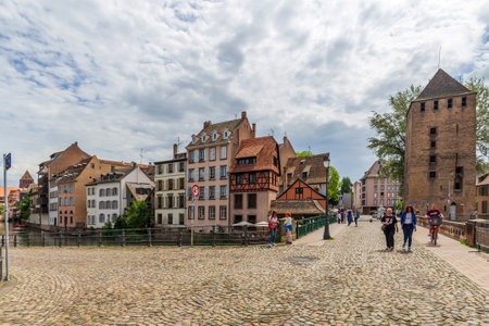 Strasbourg, France - May 13, 2024: Scenic Bridge with Historic Tower in Petite-France Strasbourgのeditorial素材