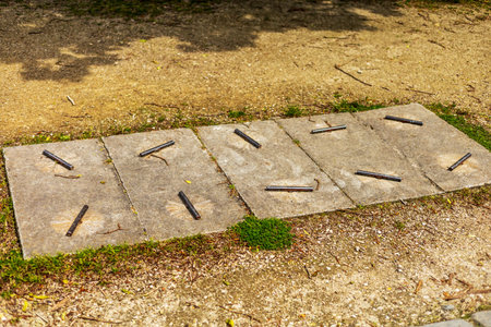 Utility Cover with Metal Rods on Stone Slabs