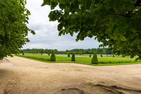 Fontainebleau, France - May 20, 2024: Expansive Pathways and Manicured Gardens at The Grand Parterre, Chateau de Fontainebleauの写真素材