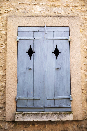 Blue Wooden Shutters with Iron Hardwareの写真素材