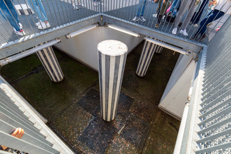 Paris, France - May 19, 2024: A fascinating underground perspective of the iconic black-and-white...