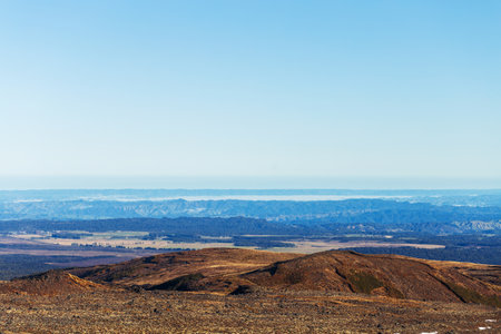 Expansive Mountainous Landscape with Clear Blue Skyの写真素材