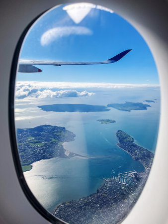 Aerial Coastal View of Auckland from Airplane Windowの写真素材