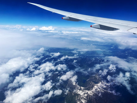 Aerial View of German Alps with Plane Wingの写真素材