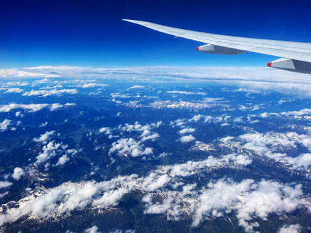 Aerial View of German Alps with Plane Wingの写真素材