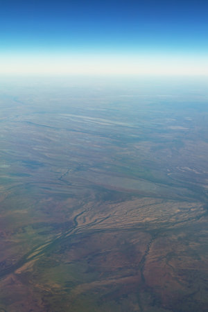 Aerial View of Vast Landscape with Riverbed Patternsの写真素材