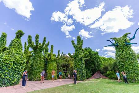 Hamilton, New Zealand - January 04, 2024: Visitors explore the surreal green sculptures at the Surrealist Garden in Hamilton Gardens, New Zealandのeditorial素材