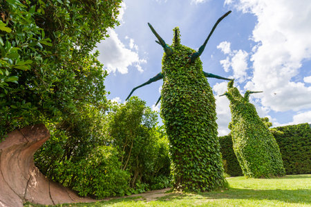 Hamilton, New Zealand - January 04, 2024: Towering green figures stand tall under the blue sky at the Surrealist Garden in Hamilton Gardens, New Zealandのeditorial素材