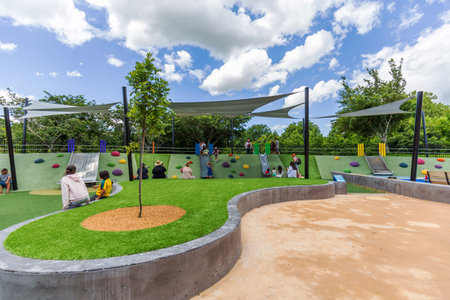 Hamilton, New Zealand - January 04, 2024: Children delight in playful adventures at the Magical Bridge Playground in Hamilton, New Zealandのeditorial素材