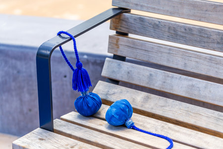 Close-Up of Traditional MÄori Poi Resting on Wooden Benchの写真素材