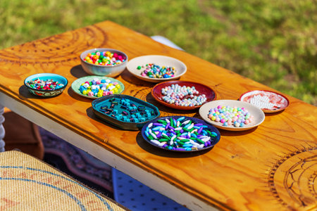 Colorful Assortment of Beads on Display at Outdoor Marketの写真素材