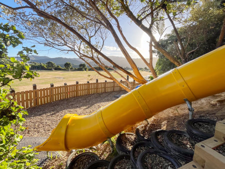 Bright Yellow Slide at Vogelmorn Park Playground on a Sunny Day, Wellingtonの写真素材