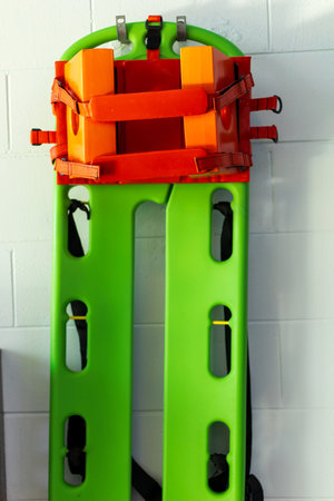 Bright Green and Orange Emergency Spine Board with Strapsの写真素材