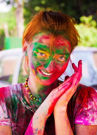 DELHI, INDIA - MARCH 20: Tourist with students of Jawaharlal Nehru University celebrate festival Holi on March 20, 2011 in Delhi, India. Holi is a spring festival celebrated as a festival of colours.の写真素材