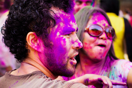 DELHI, INDIA - MARCH 20: Tourist with students of Jawaharlal Nehru University celebrate festival Holi on March 20, 2011 in Delhi, India. Holi is a spring festival celebrated as a festival of colours.のeditorial素材